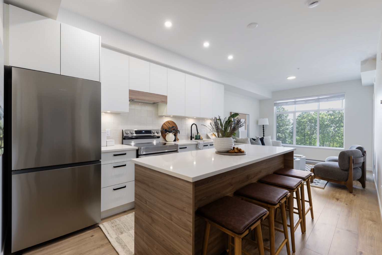 Kitchen with waterfall island and warm wood detailing