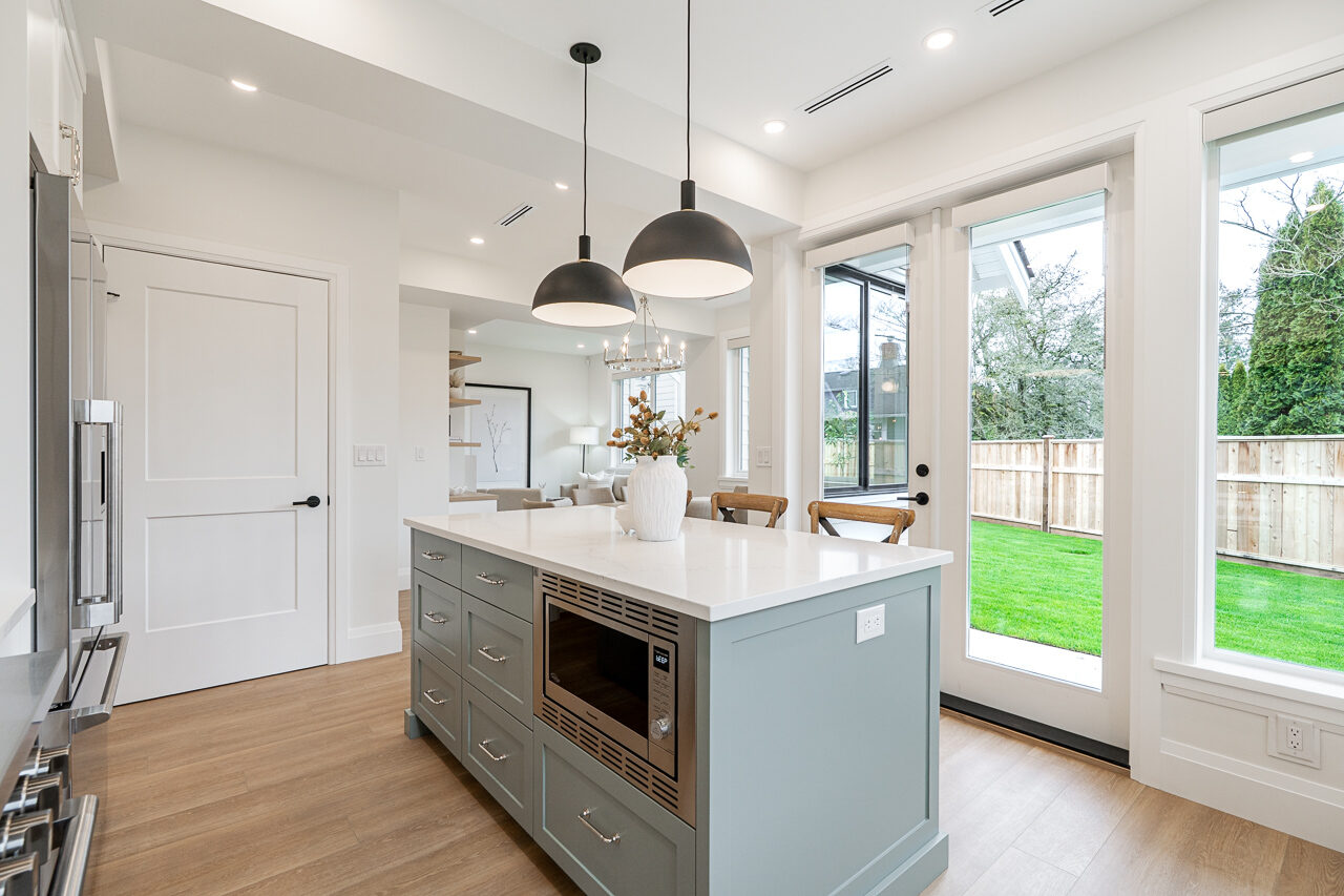 Crescent – kitchen island with open dining beyond
